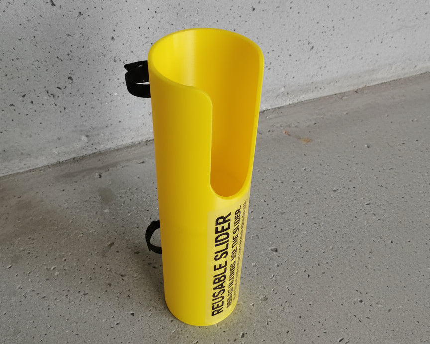 Yellow slide board on a textured surface